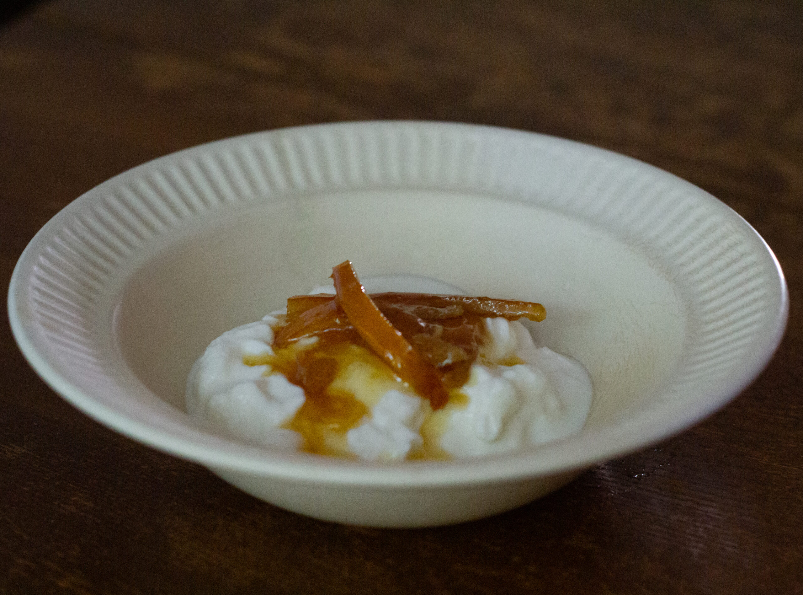 a bowl of greek yogurt with marmalade on top